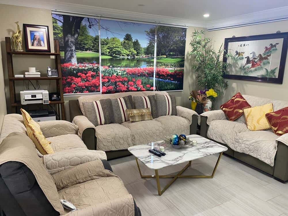 Large living room with 3 couches in the cacayorin care home